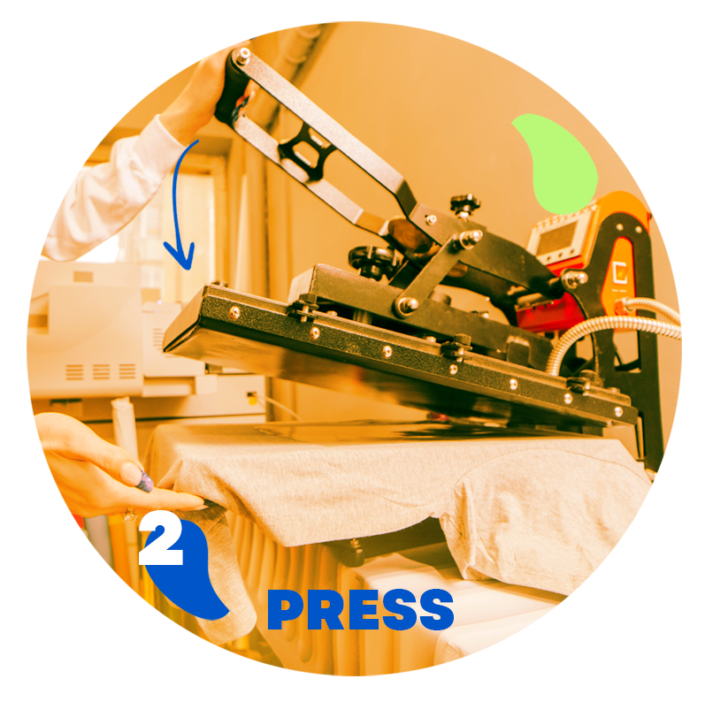Heat press machine applying pressure to a DTF transfer on a t-shirt.